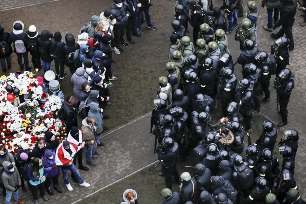 FILE - Belarusian riot police block demonstrators gathered to honor 31-year-old Raman Bandarenka, who died at a Minsk hospital after several hours of surgery due to serious injuries, during an opposition rally to protest the official presidential election results in Minsk, Belarus, on Nov. 15, 2020. A Belarusian human rights group said Thursday, July 4, 2024 that at least 10 political prisoners have been freed since the country's authoritarian president this week promised to release seriously ill people jailed in connection with massive protests nearly four years ago. (AP Photo, File)