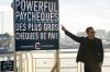 Conservative Leader Pierre Poilievre points to a campaign sign during a news conference in Vancouver on October 13, 2023. THE CANADIAN PRESS/Ethan Cairns