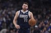 Dallas Mavericks guard Luka Doncic dribbles up court against the Boston Celtics during the first half in Game 3 of the NBA basketball finals, Wednesday, June 12, 2024, in Dallas. (AP Photo/Tony Gutierrez)