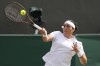 Ons Jabeur of Tunisia plays a forehand return to Robin Montgomery of the United States during their second round match at the Wimbledon tennis championships in London, Thursday, July 4, 2024. (AP Photo/Alberto Pezzali)