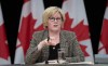 Minister of Sport and Physical Activity Carla Qualtrough speaks in Ottawa on December 11, 2023. THE CANADIAN PRESS/Adrian Wyld