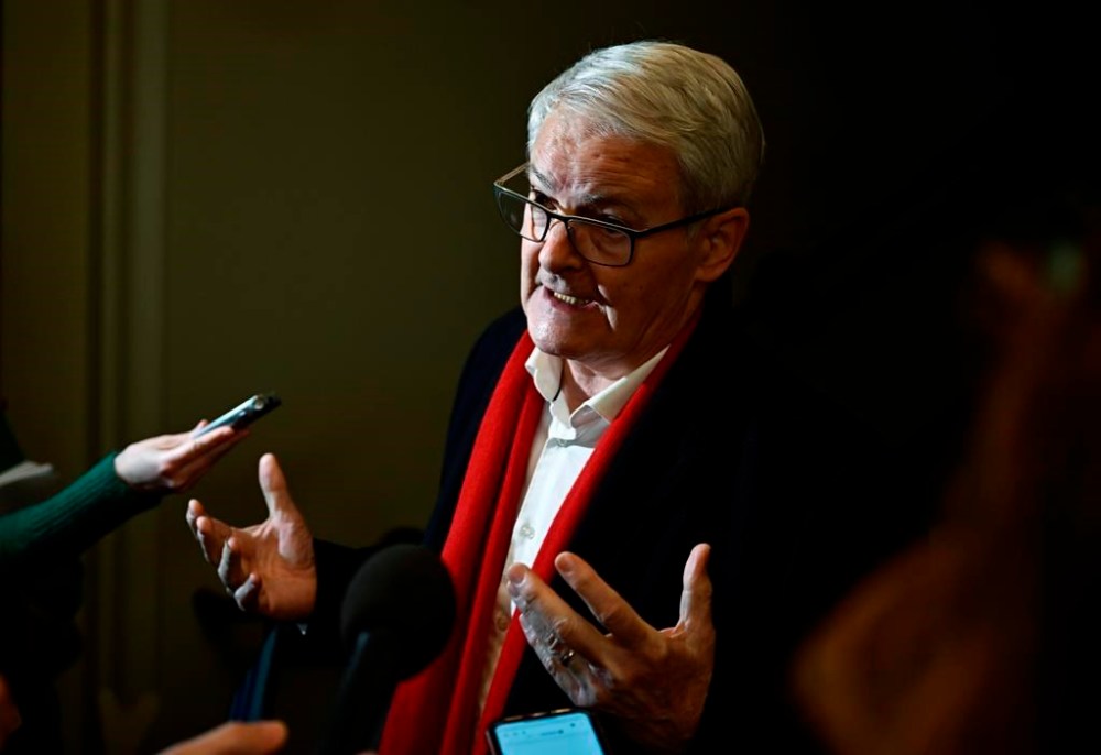 Marc Garneau speaks to reporters as he arrives for a caucus meeting on Parliament Hill in Ottawa, on Wednesday, March 8, 2023. Former foreign affairs minister Marc Garneau says Canada has lost its standing in the world under the tenure of Prime Minister Justin Trudeau. THE CANADIAN PRESS/Justin Tang