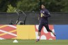 England's Jude Bellingham warms up during a training session in Blankenhain, Germany, Wednesday, July 3, 2024 ahead of the quarter final round match against Switzerland at the Euro 2024 soccer tournament. (AP Photo/Thanassis Stavrakis)