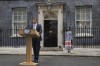 Britain's outgoing Conservative Party Prime Minister Rishi Sunak speaking outside 10 Downing Street before going to see King Charles III to tender his resignation in London, Friday, July 5, 2024. Sunak and his Conservative Party lost the general election held July 4, to the Labour Party, whose leader Keir Starmer is set become Prime Minister later Friday. Sunak's wife Akshata Murty is in the background. (AP Photo/Kin Cheung)