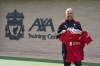 New Liverpool manager Arne Slot holds a team jersey during a photocall at the AXA Training Centre, Liverpool, England, Friday, July 5, 2024. (Peter Byrne/PA via AP)