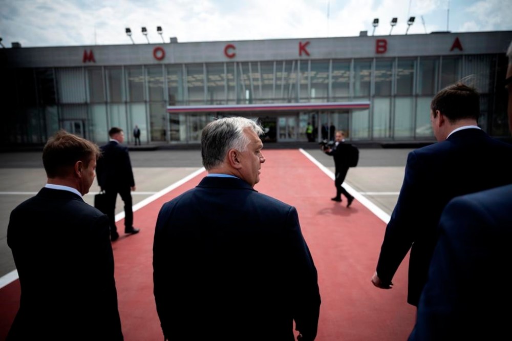 In this picture provided by the Hungarian Prime Minister's Press Office, Hungarian Prime Minister Viktor Orban, center, arrives in Moscow, Russia, Friday, July 5, 2024. Orbán has arrived in Moscow for talks with Russian President Vladimir Putin, Orbán’s press chief said Friday, a rare visit to Russia by a European leader since it invaded Ukraine more than two years ago. (Vivien Cher Benko/Hungarian PM's Press Office/MTI via AP)