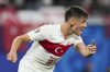 Turkey's Arda Guler yells to a teammate during a round of sixteen match between Austria and Turkey at the Euro 2024 soccer tournament in Leipzig, Germany, Tuesday, July 2, 2024. (AP Photo/Martin Meissner)