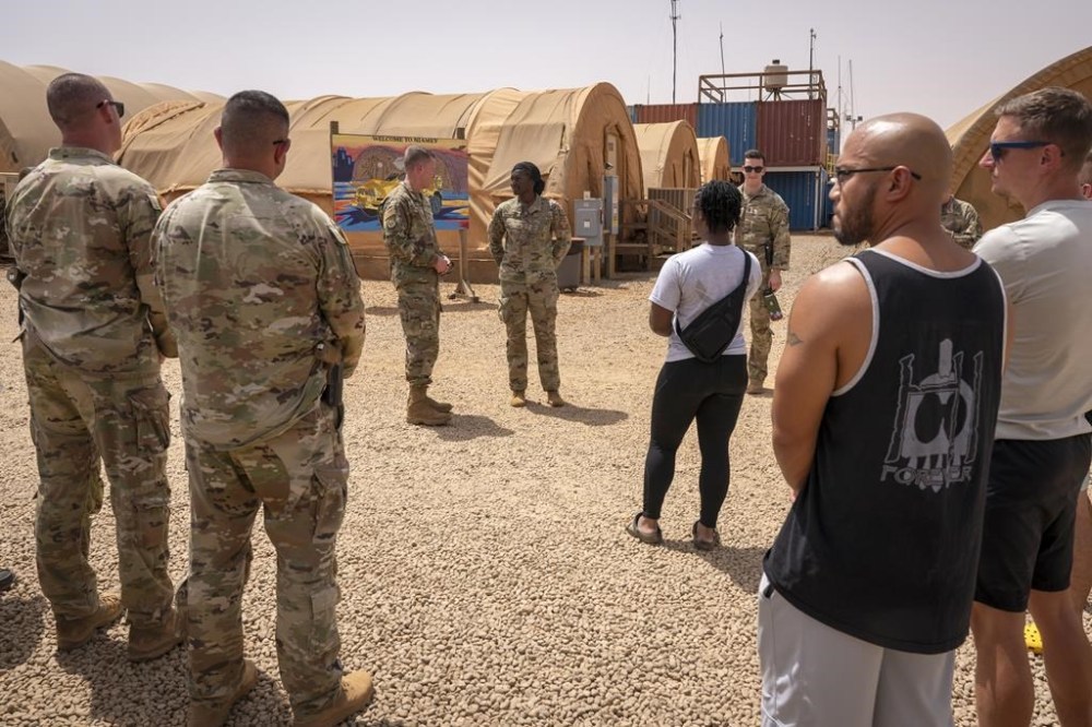 In this image by the U.S. Air Force, Maj. Gen. Kenneth P. Ekman speaks to military members in front of a