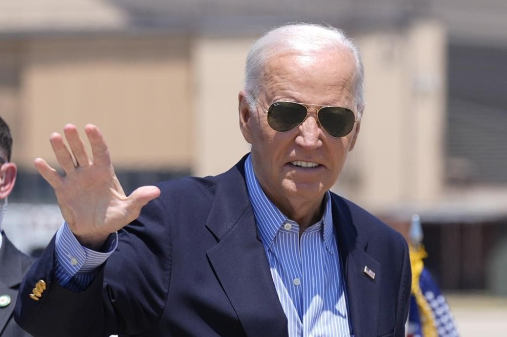 President Joe Biden waves as he arrives to board Air Force One at Andrews Air Force Base, Md., en route to a campaign trip in Madison, Wis., Friday, July 5, 2024. (AP Photo/Manuel Balce Ceneta)