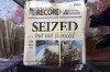 FILE - A stack of the Marion County Record sits in the back of the newspaper's building, awaiting unbundling, sorting and distribution, Aug. 16, 2023, in Marion, Kan. A former reporter for a weekly Kansas newspaper has agreed to accept $235,000 to settle part of her federal lawsuit over a police raid on the paper that made a small town the focus of a national debate over press freedoms. (AP Photo/John Hanna, File)