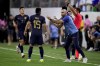 Ecuador's coach Felix Sanchez, right, talks to his player Angel Mena during a Copa America quarterfinal soccer match against Argentina in Houston, Thursday, July 4, 2024. (AP Photo/Kevin M. Cox)