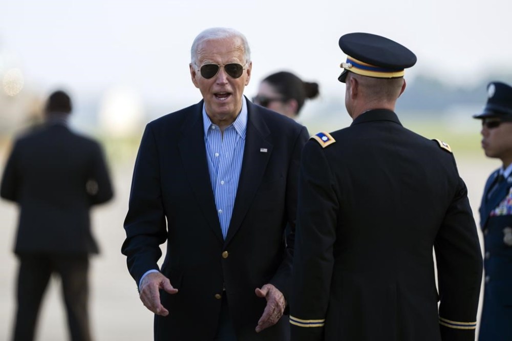 President Joe Biden responds to questions from the traveling press as he arrives at Delaware Air National Guard Base in New Castle, Del., Friday, July 5, 2024, from a campaign rally in Madison, Wis. (AP Photo/Manuel Balce Ceneta)