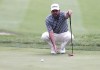Jason Day lines up his putt on the seventh hole at the John Deere Classic golf tournament Friday, July 5, 2024, at TPC Deere Run in Silvis, Ill. (Roy Dabner/Quad City Times via AP)