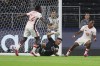 Venezuela goalkeeper Rafael Romo (22) allows a goal during a Copa America quarterfinal soccer match between Venezuela and Canada in Arlington, Texas, Friday, July 5, 2024. (AP Photo/Richard Rodriguez)