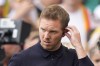 Germany's head coach Julian Nagelsmann attends an interview on the pitch before a quarter final match between Germany and Spain at the Euro 2024 soccer tournament in Stuttgart, Germany, Friday, July 5, 2024. (AP Photo/Matthias Schrader)