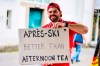 A Swiss fan shows a sign reading 