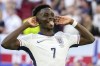 England's Bukayo Saka reacts after scoring by penalty during a quarterfinal match between England and Switzerland at the Euro 2024 soccer tournament in Duesseldorf, Germany, Saturday, July 6, 2024. (AP Photo/Darko Vojinovic)