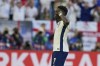 England's Bukayo Saka celebrates after scoring during the penalty shootout of a quarterfinal match between England and Switzerland at the Euro 2024 soccer tournament in Duesseldorf, Germany, Saturday, July 6, 2024. (AP Photo/Martin Meissner)