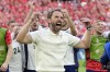 England's manager Gareth Southgate celebrates after winning the penalty shootout of a quarterfinal match between England and Switzerland at the Euro 2024 soccer tournament in Duesseldorf, Germany, Saturday, July 6, 2024. (AP Photo/Martin Meissner)