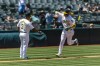 Oakland Athletics' Tyler Nevin (26) is congratulated by third base coach Eric Martins (3) as he runs the bases after hitting a solo home run against the Baltimore Orioles during the fourth inning of a baseball game Saturday, July 6, 2024, in Oakland, Calif. (AP Photo/John Hefti)