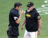 Pittsburgh Pirates manager Derek Shelton, right, questions a ball and strike call by umpire John Tumpane, left, during the seventh inning of a baseball game against the New York Mets in Pittsburgh, Saturday, July 6, 2024. Shelton was ejected for his protest. (AP Photo/Gene J. Puskar)