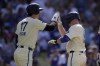 Los Angeles Dodgers' Will Smith, right, is congratulated by Shohei Ohtani after hitting a two-run home run during the first inning of a baseball game against the Milwaukee Brewers Saturday, July 6, 2024, in Los Angeles. (AP Photo/Mark J. Terrill)