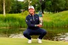 Scotland's Ewen Ferguson poses with the trophy after winning the BMW International Open Golf tournament in Munich/Eichenried, Germany, Sunday, July 7, 2024. (Christian Kolbert/kolbert-press/dpa via AP)