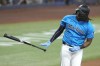 Miami Marlins' Josh Bell tosses his bat as he draws a walk during the third inning of a baseball game against the Chicago White Sox, Sunday, July 7, 2024, in Miami. (AP Photo/Lynne Sladky)
