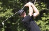 Third-round leader Davis Thompson watches his tee shot on the 16th hole during the third round of the John Deere Classic on Saturday, July 6, 2024, at TPC Deere Run, in Silvis, Ill. (Roy Dabner/Quad City Times via AP)