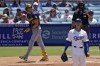 Milwaukee Brewers' Christian Yelich, left, heads to first for a two-run home run as Los Angeles Dodgers starting pitcher Justin Wrobleski watches during the fourth inning of a baseball game Sunday, July 7, 2024, in Los Angeles. (AP Photo/Mark J. Terrill)