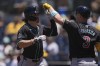 Arizona Diamondbacks' Corbin Carroll, left, celebrates with teammate Joc Pederson after hitting a home run during the first inning of a baseball game against the San Diego Padres, Sunday, July 7, 2024, in San Diego. (AP Photo/Gregory Bull)