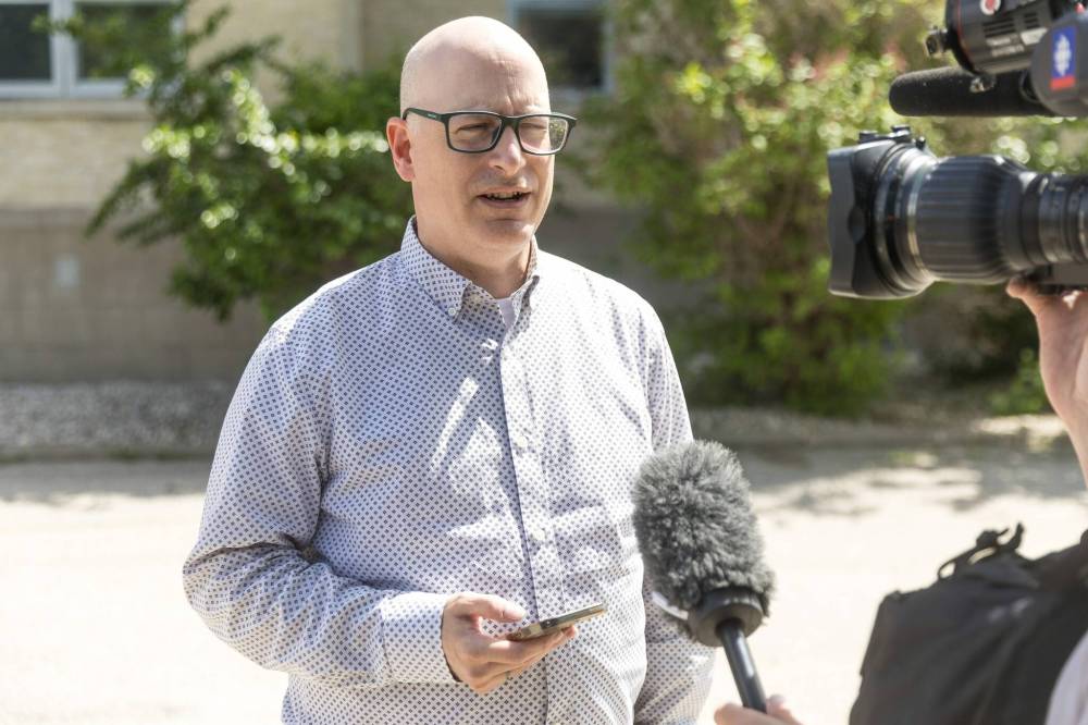 Nicholas Greco, provost of Providence University College and Theological Seminary in Otterburne, speaks to members of the media on Wednesday. (Mike Deal / Free Press)