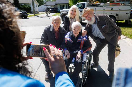 MIKE DEAL / FREE PRESS
                                Ray St. Germain and his wife Glory pose for a photo with musicians Al Simmons (left) and Fred Penner (right) during the honorary renaming of St. Michael Road in St. Vital.