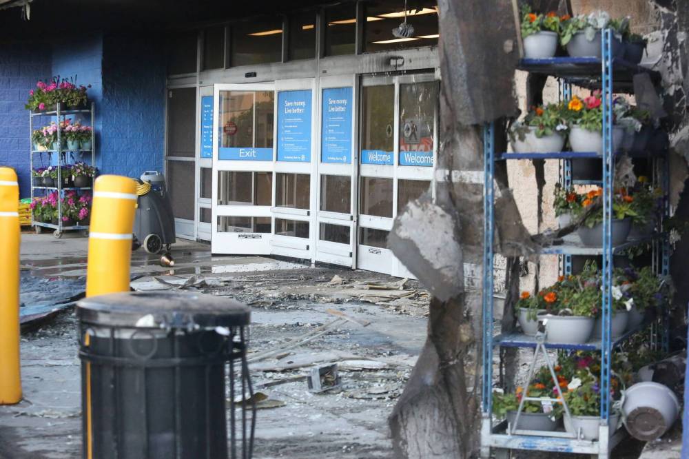 Photos by Matt Goerzen / The Brandon Sun
Scorched glass doors and burnt rubble mark the entrance of Brandon’s Walmart shopping centre at the Corral Centre on Friday.
