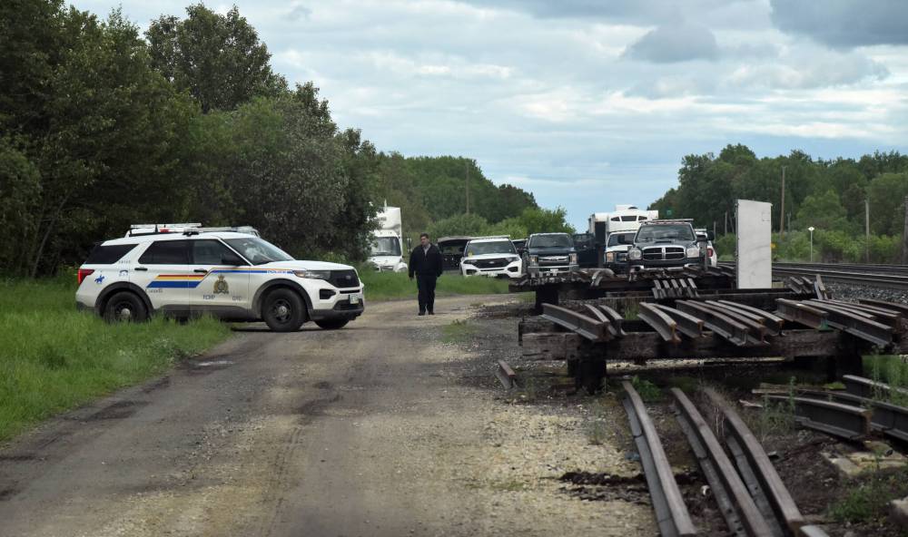 Mark T. Buss / Clipper Publishing
A heavy police presence near Molson, where Brittany Dawn Storey’s body was believed to be found in a submerged vehicle.