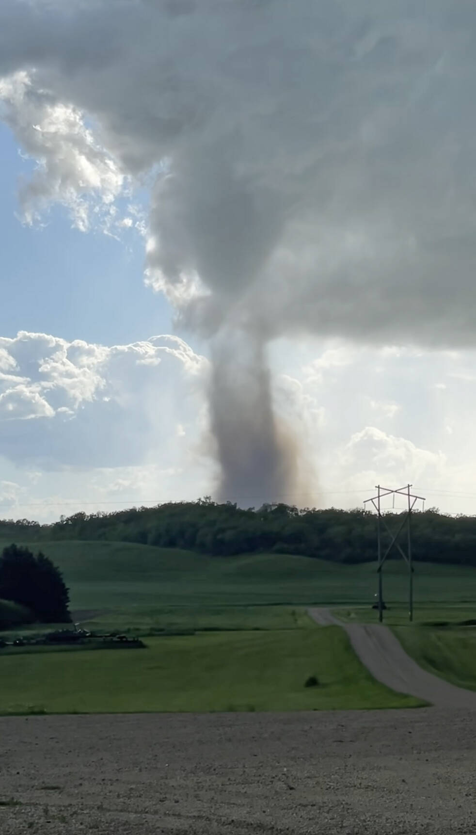 A suspected tornado touches down near Bruxelles, southeast of Brandon early Wednesday evening. (Jennifer Dalgleish/Facebook)