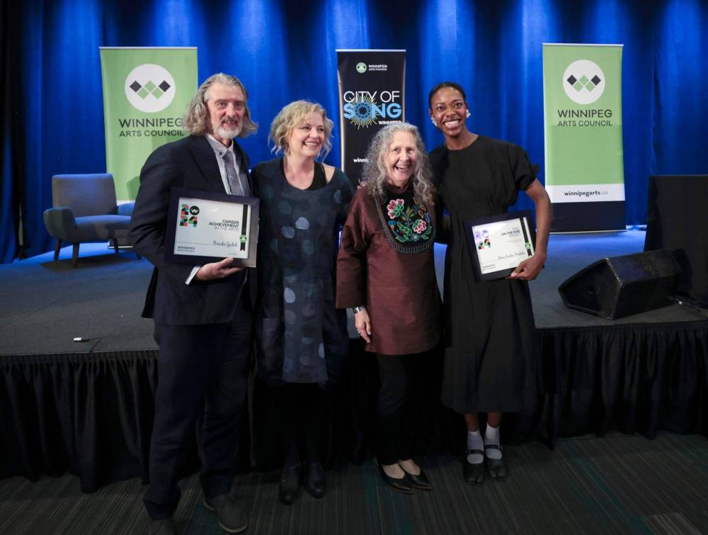 Ruth Bonneville / Free Press
                                From left: Victor Bargen (accepting the Career Achievement Award for his wife, Brenda 
Gorlick); Making a Mark Award winner Sharon Bajer; Making a Difference Award winner Jennine Krauchi; and Ekene Emeka-Maduka, winner of the RBC On the Rise Award