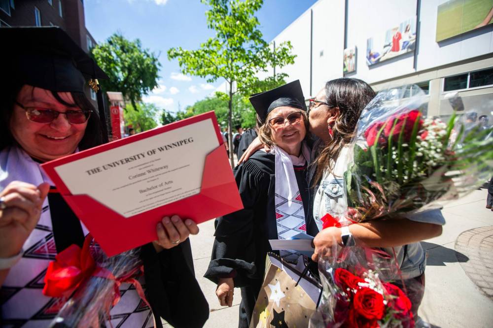 MIKAELA MACKENZIE / FREE PRESS
                                Berens River education director Kristen Everett (right) embraces U of W Developmental Studies program graduate Ida May MacDonald on Friday, June 14, 2024.