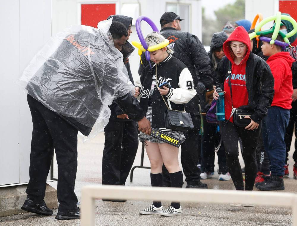 JOHN WOODS / FREE PRESS FILES
Security personnel search people as they enter the Red River Exhibition in June 2022.