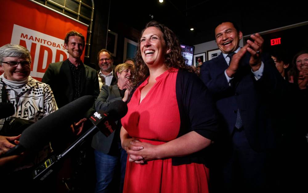 JOHN WOODS / FREE PRESS
Carla Compton, with Premier Wab Kinew and supporters, beat Tory Lawrence Pinsky by more than 600 votes in the byelection.