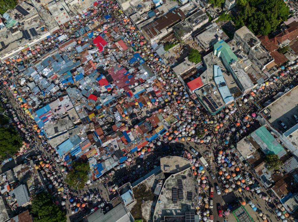 The Associated Press
People crowd Petion Ville’s market, in the suburbs of Port-au-Prince, Haiti on May 17.