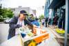MIKAELA MACKENZIE / FREE PRESS
                                Joanne Nimik packs up her food bank box at Agape Table on Furby Street Tuesday.