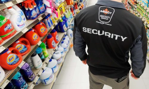 MIKE DEAL / FREE PRESS ILLUSTRATION 
An Impact Security guard walks down a grocery isle.
240531 - Friday, May 31, 2024.