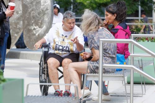 MIKE DEAL / FREE PRESS
                                Sandra Guiboche (in wheelchair), sits outside the Law Courts Building during a break for lunch in her trial Wednesday.