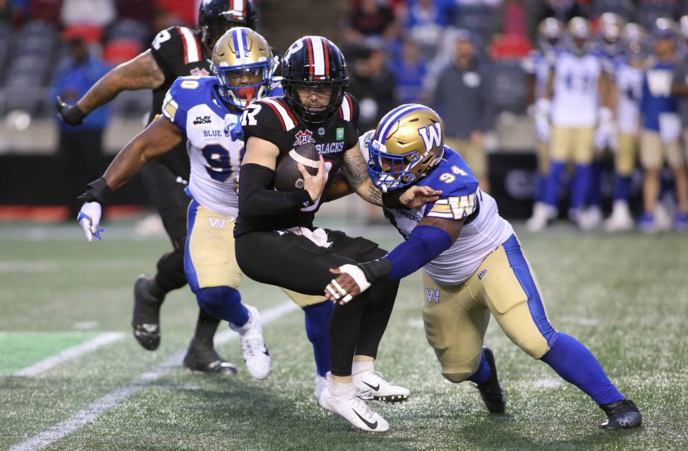 Patrick Doyle / THE CANADIAN PRESS
Devin Adams (right) is looking to add to his sack total against the B.C. Lions in his first start in the CFL.
