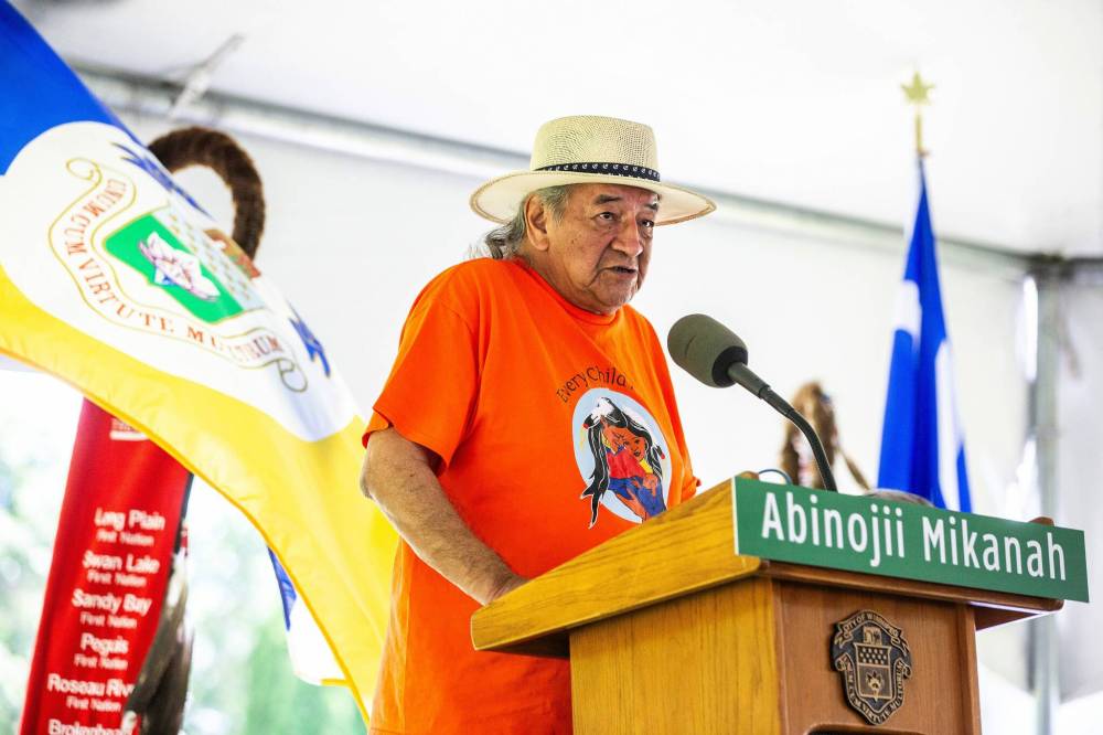 Dennis White Bird speaks on behalf of the Assembly of Manitoba Chiefs at the Abinojii Mikanah renaming ceremony on Friday. (Mikaela MacKenzie / Free Press)