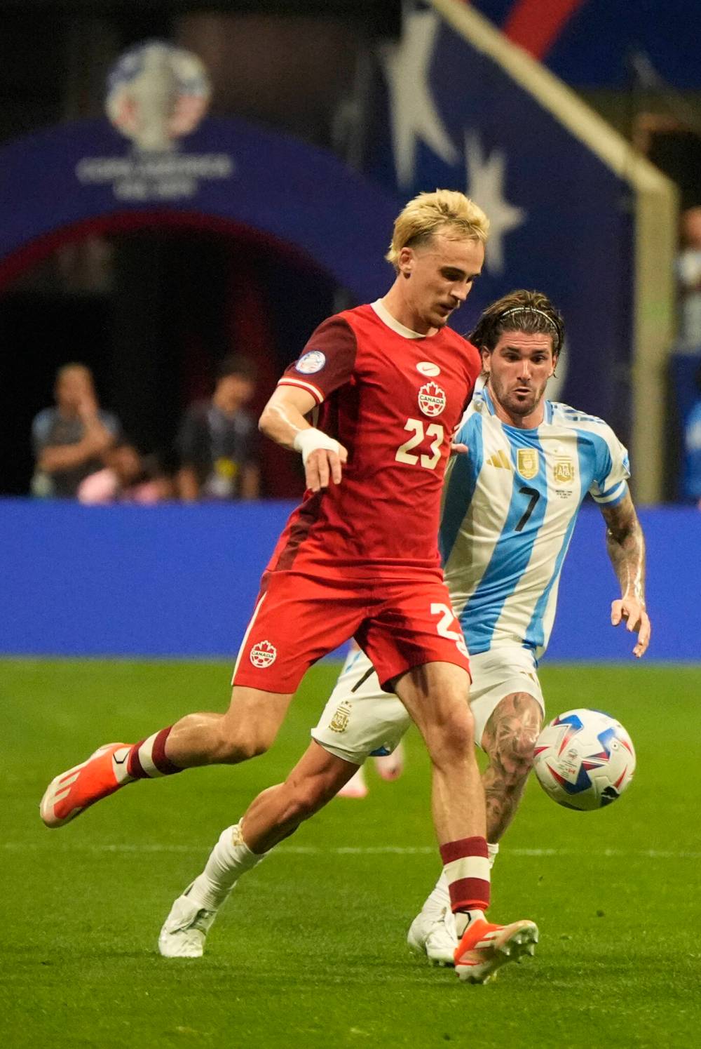 Mike Stewart / The Associated Press
Canada’s Liam Millar (left) and Argentina’s Rodrigo De Paul in action Thursday night in Atlanta.