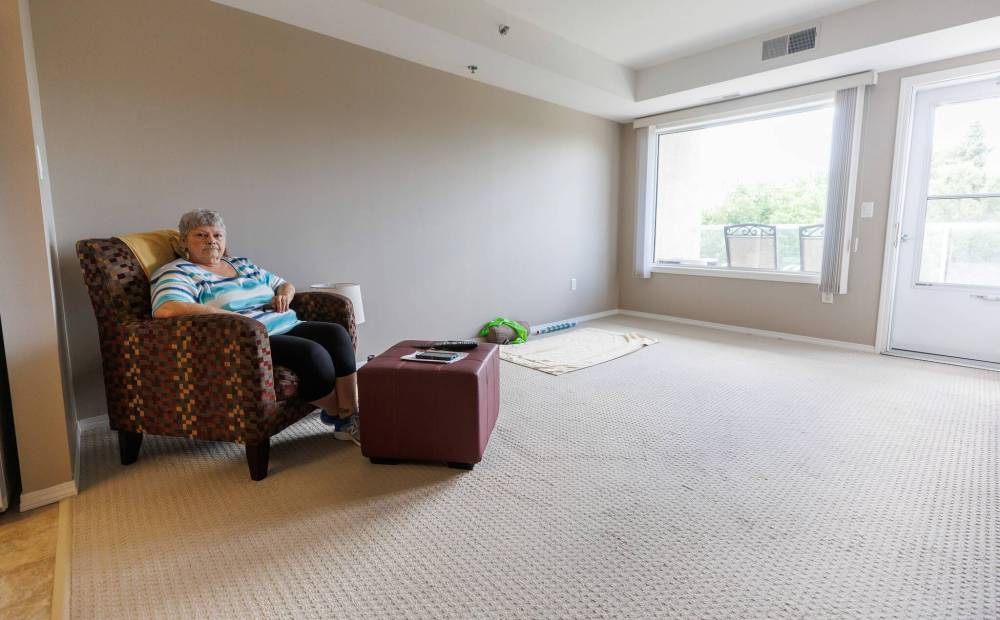 MIKE DEAL / FREE PRESS
                                Joanne Francis in her new apartment at St James Kiwanis Manor. Francis was one of hundreds who were evacuated from the Birchwood Terrace apt building - and she is one of the majority who have found new apartment suites - but their furniture is still in a building they can’t access.