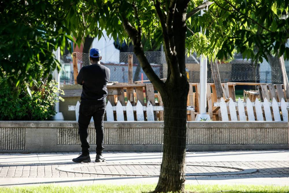 JOHN WOODS / FREE PRESS
                                A person looks at what’s left of a pro-Palestinian encampment Monday at the University of Winnipeg campus.