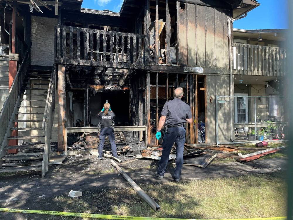 Two people were in critical condition Wednesday after a fire in an apartment on Keewatin Street. (Ruth Bonneville / Free Press)
